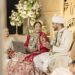 Bride Works on Laptop at Wedding