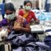 Women learning tailoring skills at a workshop in Capital Region