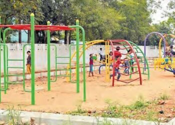 Modern walking track and open gym equipment at a Vijayawada city park