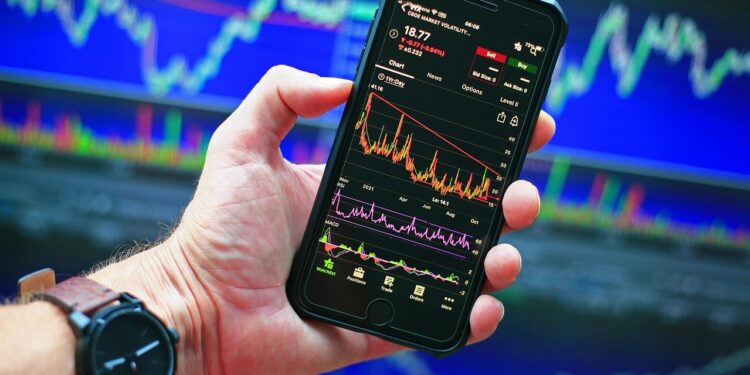 Sensex and Nifty charts showing market gains after RBI announcement