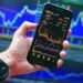 Sensex and Nifty charts showing market gains after RBI announcement