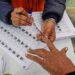 Voters casting ballots at municipal election polling station 2026