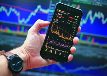 Sensex and Nifty charts showing market gains after RBI announcement